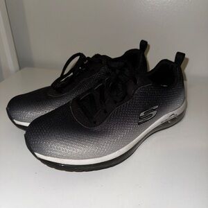 Skechers women’s Black and White Athletic Shoes